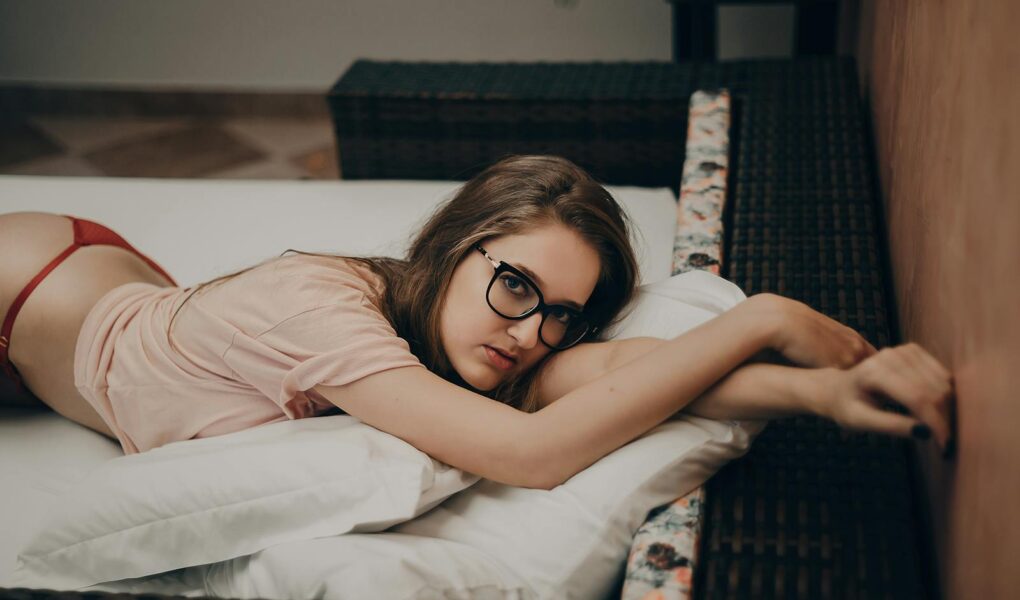 Woman Lying in Beige Crew-neck Shirt