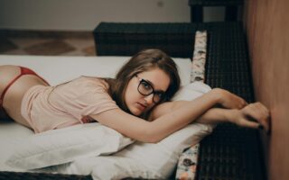 Woman Lying in Beige Crew-neck Shirt