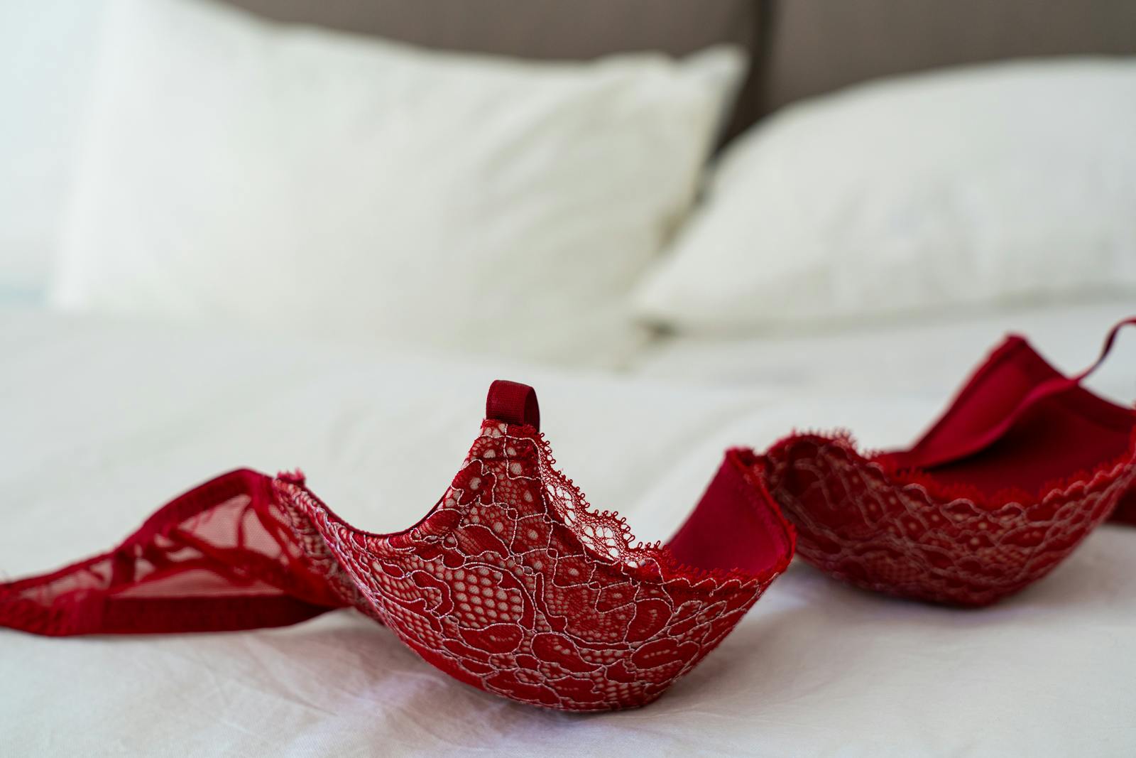 Red Lace Brassiere on White Bed